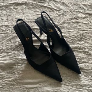 black pointed toe sling back heels